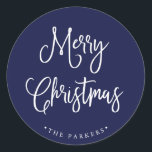 Merry Christmas | Handwritten Script on Navy Blue Classic Round Sticker<br><div class="desc">This simple and trendy holiday sticker says "Merry Christmas" in rustic,  white handwritten script on a dark,  navy blue background.</div>