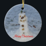 Merry Christmas Little Snowman Year Ceramic Tree Decoration<br><div class="desc">Cute little nature snowman with pine cone nose,  pebble rocks for eyes,  smile and buttons,  branches for arms,  and a green bush topper for his hat.  Merry Christmas. is written in red script.  Backside has  snowman and area to insert Current Year.  Original Photography by TamiraZDesigns.</div>
