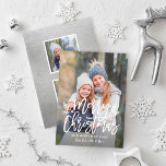 Merry Christmas Modern Silver Script Photo Collage Holiday Card<br><div class="desc">Elegant holiday photo card design features a modern Merry Christmas with holly berry branches overlay design with white custom text that can be personalized. The back of the card features a silver colored background with spaces for two square photos. The silver background image can be removed and the background color...</div>