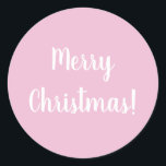 Merry Christmas Pink Typography Classic Round Sticker<br><div class="desc">Trending pink Merry Christmas design. This design has the festive message “Merry Christmas!” In modern white typography text on a light pink background. Perfect for envelope seals or for the finishing touch to your gifts or favour bags this holiday season. If you wish to change the message you can do...</div>