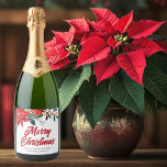 Merry Christmas Poinsettia Floral Holiday Party Sparkling Wine Label<br><div class="desc">Merry Christmas in elegant red cursive script surrounded by lovely green pine needles and festive red poinsettia flowers. This gorgeous floral border is a chic touch to your corporate holiday party sparkling wine label. Customise with your company or business name between the winter botanical design.</div>