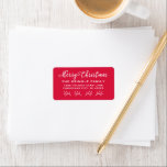 Merry Christmas Red Script Holiday Return Address Label<br><div class="desc">Modern Merry Christmas in white script writing holiday return address labels. Personalise the custom last name / family and address text. The red printed background colour can be customised to coordinate with your holiday mailing.</div>