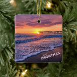 Merry Christmas San Diego Beach Pier Sunset Ceramic Ornament<br><div class="desc">"Merry Christmas" Pretty California Beach Pier Sunset (purple, orange, pink)... The sun is at the end of the Crystal pier, in Pacific Beach, San Diego, California, USA, with a beautiful foamy wave in the foreground, and the orange purple ombre sky is reflecting on the wet sand and ocean water. This...</div>