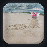 Merry Christmas Sandman On Beach Paper Plate<br><div class="desc">Cute sand snowman with Merry Chrsitmas text,  sunglasses,  and a striped stocking cap on beach sand.</div>