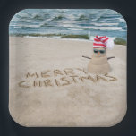 Merry Christmas Sandman On Beach Paper Plate<br><div class="desc">Cute sand snowman with Merry Chrsitmas text,  sunglasses,  and a striped stocking cap on beach sand.</div>