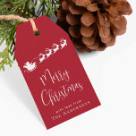 Merry Christmas Santa Reindeer Red Gift Tags<br><div class="desc">Festive holiday red gift tags featuring a white silhouette of reindeers flying Santa's sleigh through air,  "Merry Christmas" in a stylish white script and your name in simple modern white typography.</div>