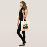 Merry Christmas  | Santa & Tree Design Tote Bag<br><div class="desc">Celebrate the holidays in style with this fun and festive Merry Christmas T-Shirt! Featuring a joyful Santa Claus and a beautifully decorated Christmas tree, this holiday shirt is perfect for kids, adults, and anyone who loves Christmas magic. Ideal for holiday parties, Christmas morning photos, or as a thoughtful gift for...</div>