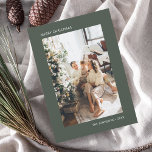 Merry Christmas Simple Photo Green Holiday Card<br><div class="desc">Experience the essence of the festive season with our minimalist personalised Christmas card, where simplicity meets elegance. The card's front is an understated masterpiece, showcasing your chosen photo as its focal point, allowing the memories to shine. Accompanying the image, the phrase 'Merry Christmas' and your name are gracefully presented in...</div>