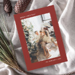 Merry Christmas Simple Photo Red Holiday Card<br><div class="desc">Experience the essence of the festive season with our minimalist personalised Christmas card, where simplicity meets elegance. The card's front is an understated masterpiece, showcasing your chosen photo as its focal point, allowing the memories to shine. Accompanying the image, the phrase 'Merry Christmas' and your name are gracefully presented in...</div>