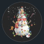 Merry Christmas Snowman Decor Xmas Lights Surround Classic Round Sticker<br><div class="desc">An ugly Christmas sweater alternative. Snowman face with carrot nose. Cute funny build a snowman costume gift. Christmas shirt for toddlers matching pyjamas for family. Snowman costume for Christmas, Hanukkah, winter vacation. Funny Christmas Snowman Face Leopard Glasses Santa Hat Girls, Wear This Funny Christmas Shirt Throughout The Season or To...</div>