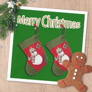 Merry Christmas Snowman On Stocking Over Green Napkin