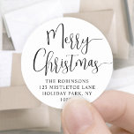 Merry Christmas Trendy Script Round Return Address Classic Round Sticker<br><div class="desc">Add a stylish finishing touch to holiday card envelopes with chic round Merry Christmas return address labels. All wording on this template is simple to customise using the Zazzle design tool. The modern minimalist black and white design features trendy handwritten script calligraphy and classic typography name and address. These unique...</div>