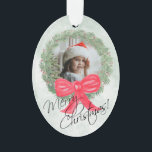 Merry Christmas Watercolor Pine Wreath Photo Frame Ornament<br><div class="desc">This beautiful ornament features  your photo inside a hand painted watercolor wreath of pine branches and berries with a big red bow on a marbled green background. The caption reads: Merry Christmas! There is space for a short greeting and signature on the back.</div>