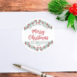 Merry Christmas Winter Greenery Return Address Classic Round Sticker<br><div class="desc">Celebrate the joy of the season with our customisable Christmas return address sticker! This round sticker, adorned with a festive red and green wreath design, adds a touch of holiday cheer to your Christmas mail. The sticker features your custom text, which can be fully personalised to your family’s name. The...</div>
