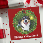 Merry Christmas Wreath Custom Dog Photo Holiday Card<br><div class="desc">Beautiful custom dog Christmas card featuring a pretty green holiday wreath on a red background. Replace with your pet's photo in the centre of the holly berry wreath and add your puppy or cat picture for your friends and family. Merry Christmas is written in white typography.</div>