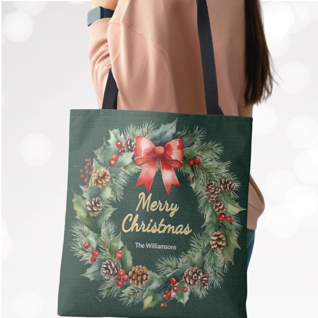 Merry Christmas Wreath with Red Bow Personalised Tote Bag (A festive green tote bag with faux gold "Merry Christmas" greeting, wreath surround and custom name)