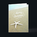 Merry Coastal Beach Christmas Starfish Card<br><div class="desc">A beach photo with a white finger starfish.</div>