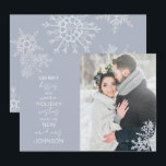 Merry Kisses Warm Wishes Snowflake Photo Holiday Card<br><div class="desc">Celebrate your first holiday season as newlyweds with our elegant Merry Kisses Warm Wishes Snowflake Photo Holiday Card Christmas card. Featuring a stunning wedding photo accented by delicate icy blue snowflakes, this card reads "merry kisses and warm holiday wishes from the new mr and mrs, " and is personalised with...</div>