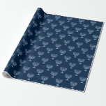 Metallic Filigree Menorah Wrapping Paper<br><div class="desc">Here we have a wrapping paper that features a metallic filigree menorah on a dark blue background. This paper is available in multiple sizes and is a match to other wrapping papers, tissue papers, gift bags and a greeting card. This is sure to make a perfect addition to your gifts...</div>