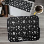 Metallic Flowers Black, Silver Floral Pattern Name Laptop Sleeve<br><div class="desc">This personalised laptop sleeve features metallic look flowers and leaves that pop out on the black background. The pearl like beads make this a unique modern design that makes a statement. To change the name click on the personalise button. A.I. is used in this design.</div>