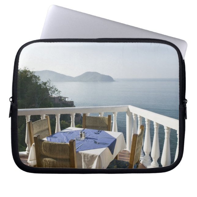Mexico, Guerrero, Zihuatanejo. Cafe Table over Laptop Sleeve (Front)