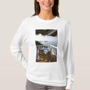 Mexico, Guerrero, Zihuatanejo. Cafe Table over T-Shirt