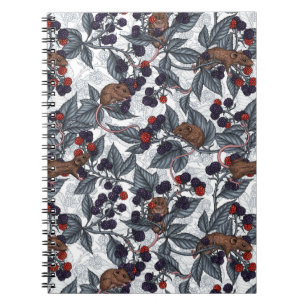 Mice and blackberries on white notebook