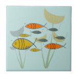 Mid Century Modern Atomic Era Fish Swimming Blue Tile<br><div class="desc">This Mid Century Modern design is inspired by the Atomic Era patterns and designs made popular in the 1950s and 1960s. The featured background colour can be customised by you to any colour you prefer. You can also make the pattern image larger or smaller in the edit mode of this...</div>