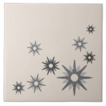 Mid-Century Modern Starburst Silver Ceramic Tile<br><div class="desc">Mid-century modern inspired design featuring vintage retro starbursts in shades of silver on a light bone-coloured background. Simple,  clean modern design.</div>