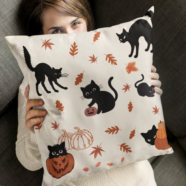 Midnight Whiskers Cushion (Add a hint of spooky charm with playful black cats and burnt orange leaves on a soft cream backdrop.)