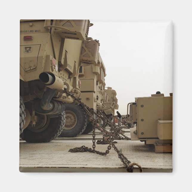 Military vehicles are locked down on semi truck magnet (Front)