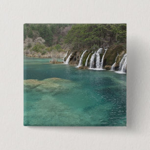 Mineral deposits make waterfalls and clear 15 cm square badge