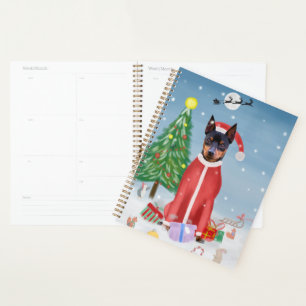 Miniature Pinsch Dog in Snow with Christmas Gifts  Planner