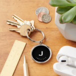 Minimal Black Classic Monogram Round Key Ring<br><div class="desc">Minimal monogrammed round keychain feature a black background with your initials and name in white typography for a simple classic professional look.</div>