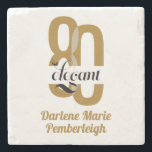 Minimal Eighty & Elegant Gold Black 80th Birthday Stone Coaster<br><div class="desc">Celebrate 80 remarkable years with style and sophistication using our Minimal Eighty & Elegant Gold Black 80th Birthday Stone Coaster. Featuring a luxurious gold background with sleek black lettering, this elegant stone coaster adds a modern, chic touch to any milestone celebration. Perfect for serving drinks or displaying as part of...</div>