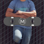 Minimal Grey Monogram Skateboard<br><div class="desc">A minimalist monogram design with grey and white monogram emblem with classic block typography initial on a simple grey background.</div>