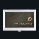 Minimal Luxury Black Gold Monogram Business Card Holder<br><div class="desc">Minimalist monogram design with brushed metallic gold monogram medallion with personalised name and title or custom text below in classic block typography on a textured background in shades of black chestnut brown. Personalise for your custom use.</div>