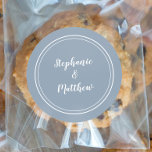 Minimalist Dusty Blue Wedding Bride Groom Favour Classic Round Sticker<br><div class="desc">Simple, minimalist and chic Wedding design features bride & groom's names in a modern design with a double framed border in white on a dusty blue background. The modern design is simple and chic. Personalise wedding details with your names in crisp white script. Be sure to see the collection link...</div>