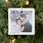 Minimalist First Married Christmas Script Photo Ceramic Ornament<br><div class="desc">Remember your first married Christmas forever with this modern,  minimalist holiday ornament,  featuring 'Christmas' in trendy,  modern blue hand lettered typography and your favourite wedding photo. The photo is repeated on the back,  with your wedding date details overlaid. Copyright Anastasia Surridge,  all rights reserved.</div>