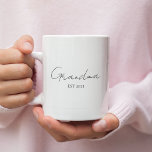 Minimalist Grandma EST 2025 | Personalised Gift Coffee Mug<br><div class="desc">Celebrate a special milestone with this Minimalist Grandma EST 2025 personalised mug — a perfect gift for a first-time grandma! Designed with elegant modern typography on a crisp white background, this mug is both meaningful and stylish. Customise the year to mark her new chapter and give her a daily reminder...</div>