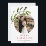 Minimalist Mistletoe Merry & Married Photo Holiday Card<br><div class="desc">A modern minimalist holiday card celebrating your first Christmas as a married couple. The design featured your favourite photo in a circle aperture adorned with a watercolor branch of mistletoe. Personalise the headline and sign off in red and dark green. On the reverse is a pattern of watercolor mistletoe branches....</div>