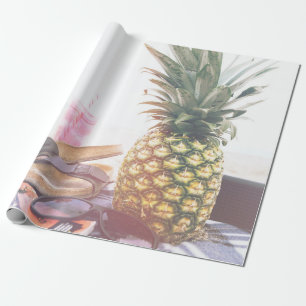 Minimalist photography of pineapple near sandals a wrapping paper
