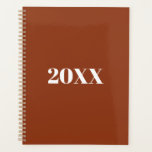 Minimalist terracotta modern typography custom planner<br><div class="desc">Minimalist terracotta and white modern typography custom simple elegant Planner.
Custom white serif text,  terracotta solid plain background.
You can personalised it with your name,  initials,  year,  etc or just delete the text,  and leave the solid plain black colour.</div>