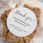 Minimalist Thank You Wedding Favour Classic Round Sticker<br><div class="desc">This minimalist thank you sticker with a chic and understated design that adds a touch of sophistication to any gift or favour. The black script on a white background creates a clean and minimalist look, while the elegant font conveys a sense of gratitude. These stickers are perfect for any occasion,...</div>