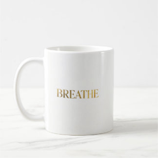 Minimalist typography with gold word breathe coffee mug