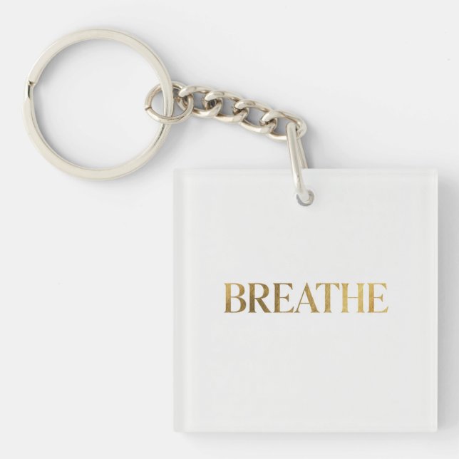 Minimalist typography with gold word breathe key ring (Front)
