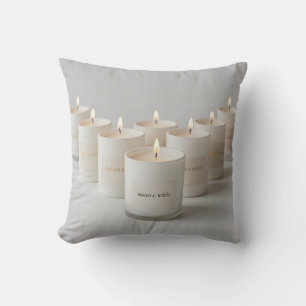 Minimalist white-line candles with tiny flames cushion