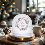 Minimalist Winter Monogram Snowglobe<br><div class="desc">Celebrate the beauty of togetherness with this personalised winter snow globe featuring a refined monogram and delicate wreath of red berries, pine sprigs, and soft neutral foliage. Perfect as a meaningful holiday keepsake or a first Christmas gift for a newlywed couple or young family. Customise with your last name and...</div>