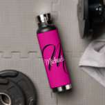 Minimalistic modern monogram initial name hot pink water bottle<br><div class="desc">Minimalistic modern monogram initial name black white. Personalizable custom name with a cursive initial behind on a hot pink colour.</div>