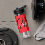 Minimalistic modern monogram initial name red water bottle<br><div class="desc">Minimalistic modern monogram initial name black white. Personalizable custom name with a cursive initial behind on a red colour.</div>